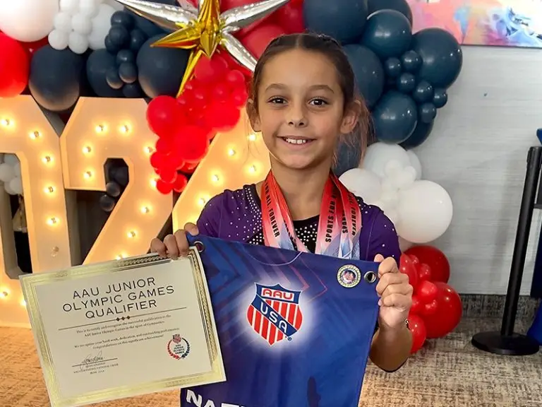 aau junior olympic qualifier with certificate and medals