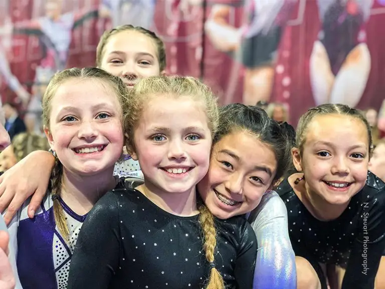 the nga team smiling at a meet