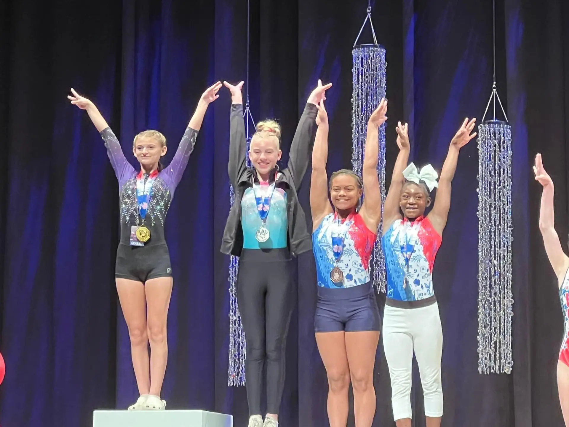 gymnasts on the podium
